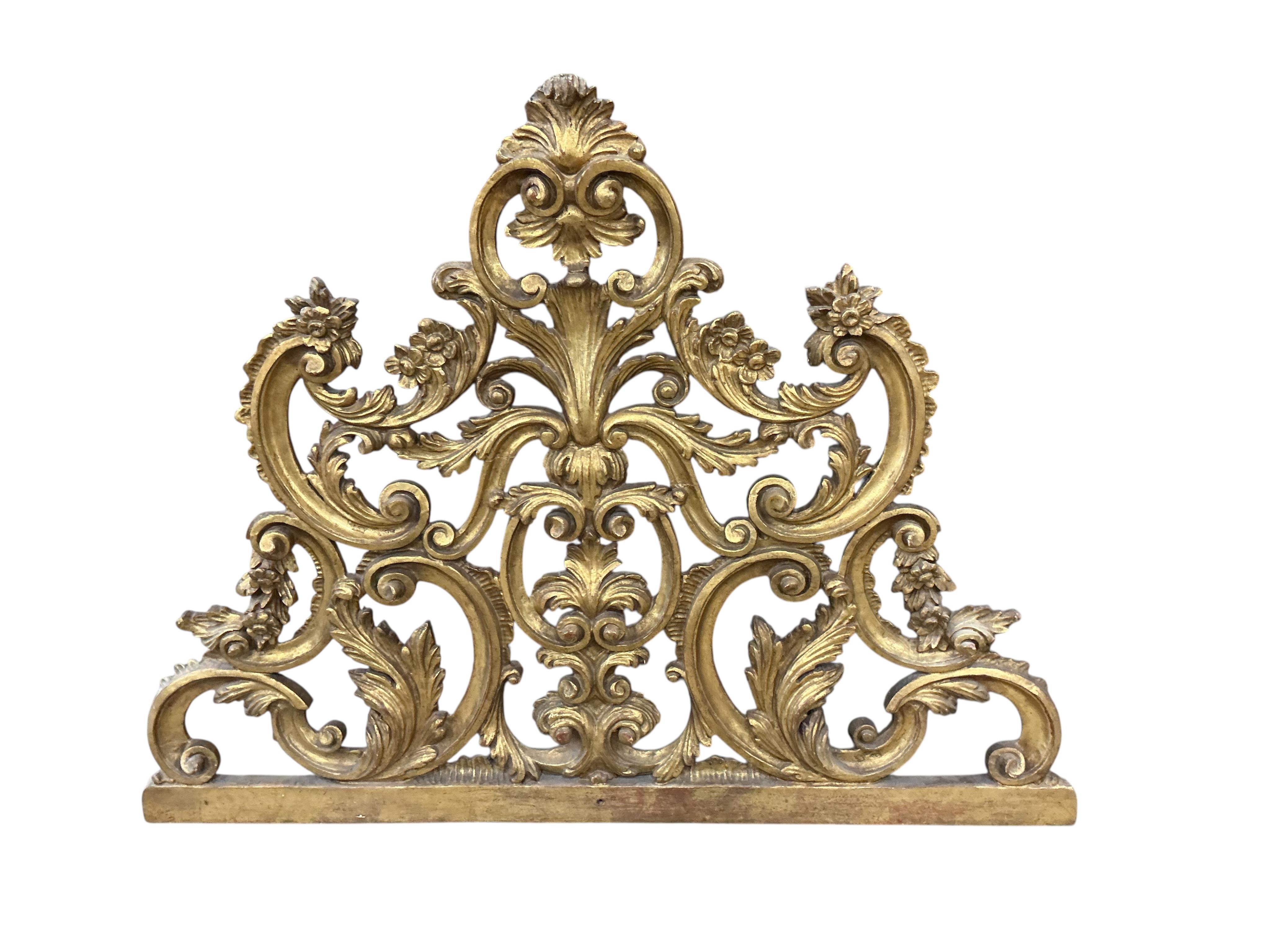 An early 20th century carved giltwood pediment, width 108cm, height 82cm